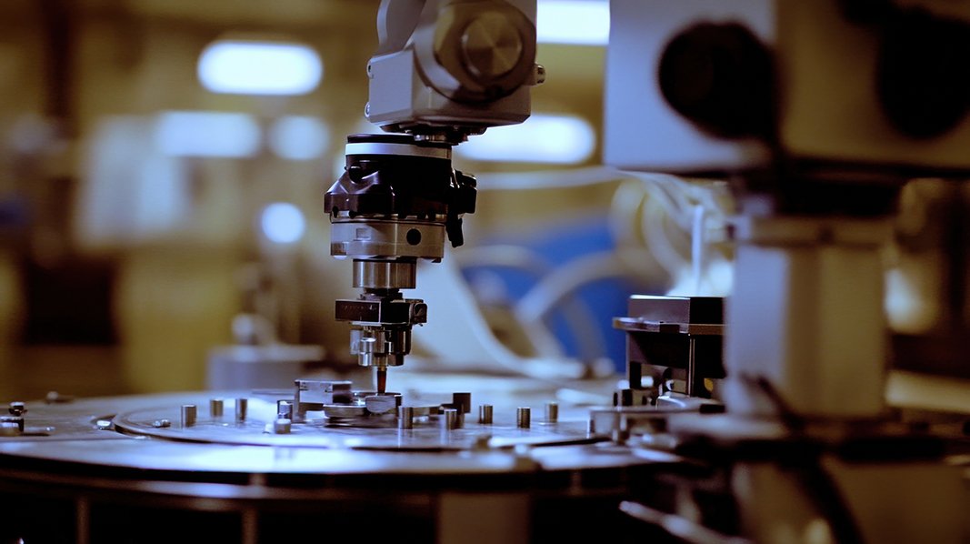 A close-up view of advanced precision machinery in a manufacturing facility. Highlighting intricate details, this setting showcases the integration of technology.