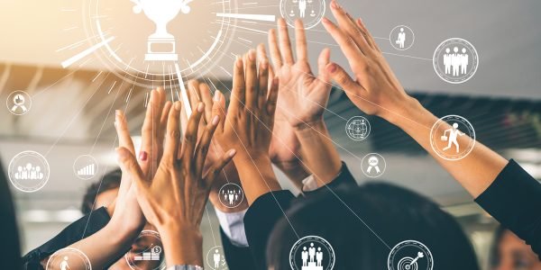 Achievement and Business Goal Success Concept - Creative business people with icon graphic interface showing employee reward giving for business success achievement.